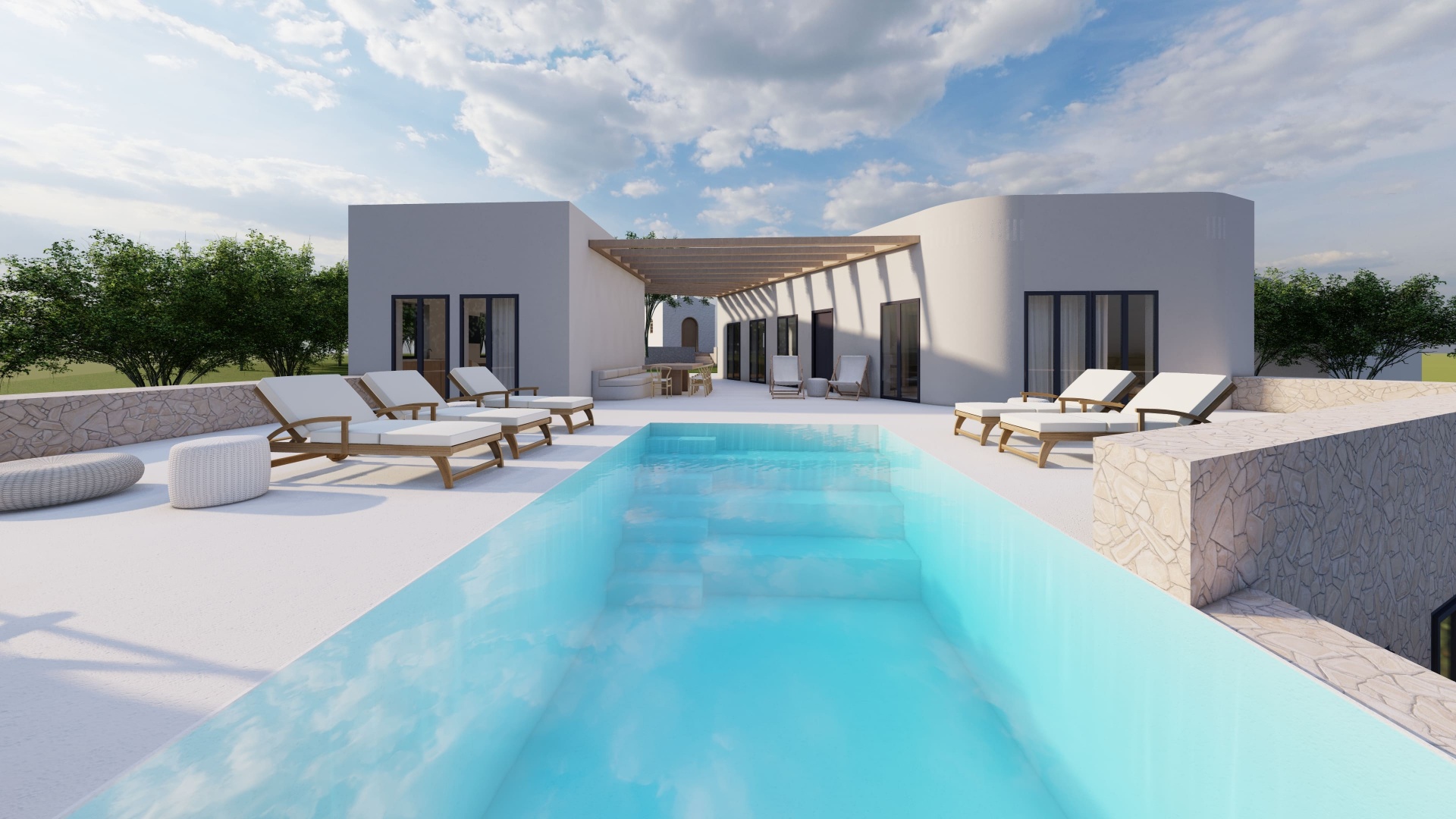 Pool and sun loungers under open sky